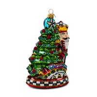 Nutcracker by Tree Glass Ornament