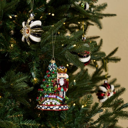 Nutcracker by Tree Glass Ornament